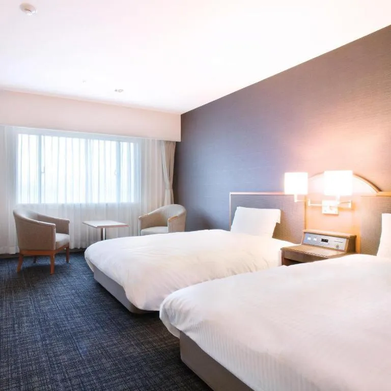 Bed in Imazu Sun Bridge Hotel