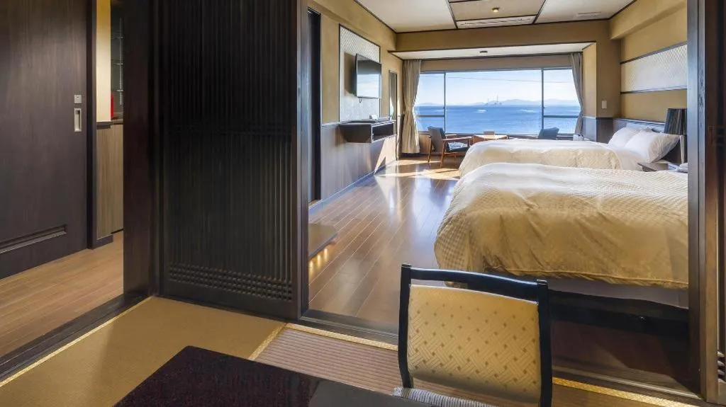 Bed in Shinojima Royal Hotel Kasuisou