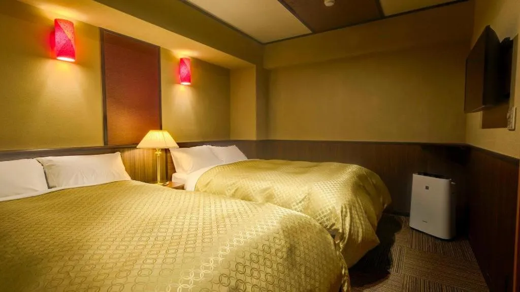 Bed in Shinojima Royal Hotel Kasuisou