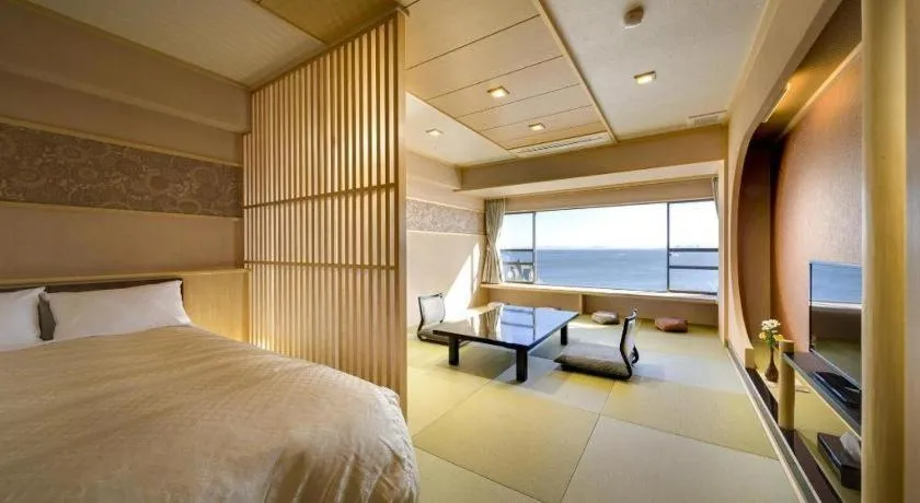 Bed in Shinojima Royal Hotel Kasuisou