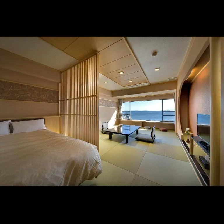 Bed in Shinojima Royal Hotel Kasuisou