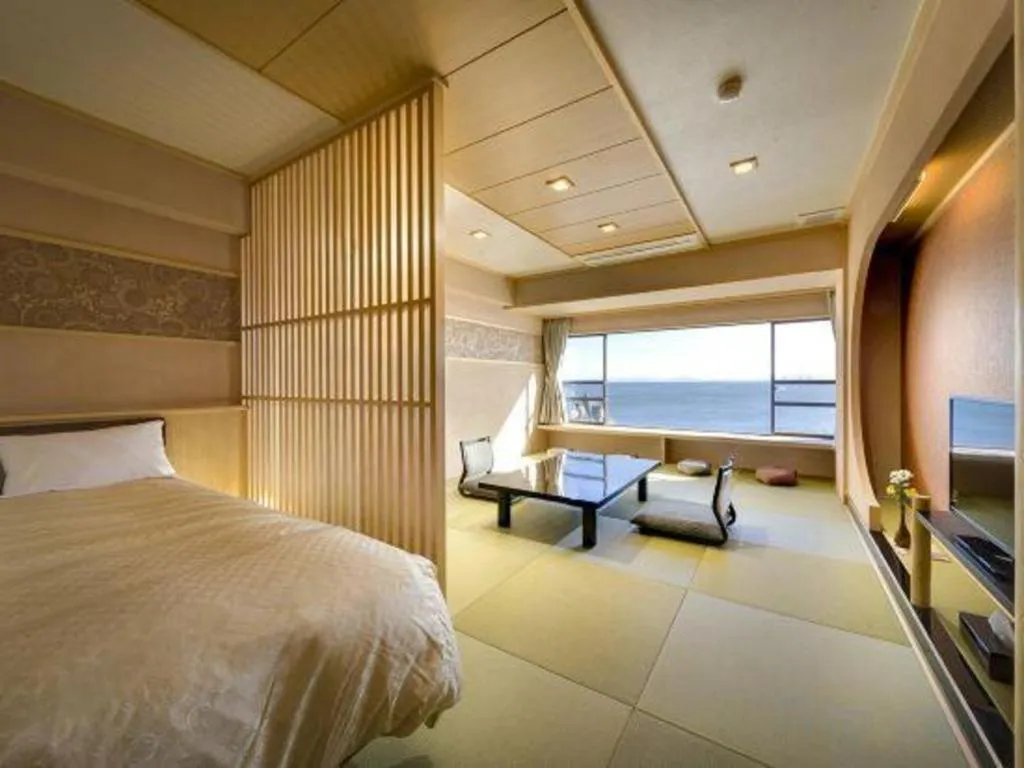 Bed in Shinojima Royal Hotel Kasuisou