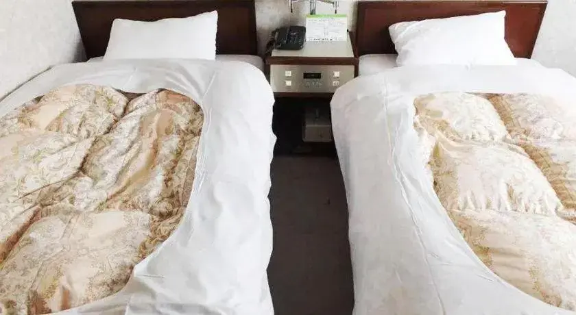 Bed in Sento Otani Hotel Bed in Sento Otani Hotel