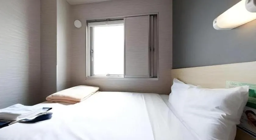 Bed in Super Hotel Arai-Niigata