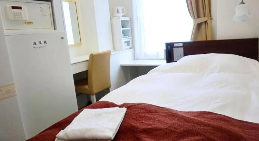 Bed in Hotel Shimbashi Sambankan