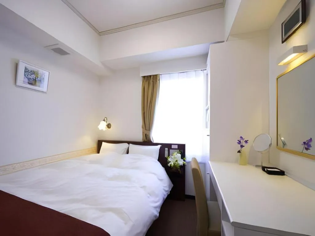 Bed in Hotel Shimbashi Sambankan