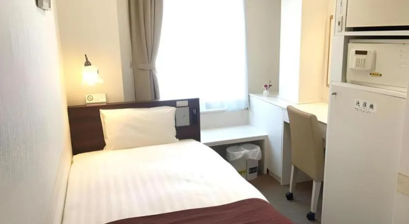 Bed in Hotel Shimbashi Sambankan