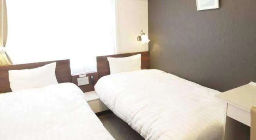 Bed in Hotel Shimbashi Sambankan