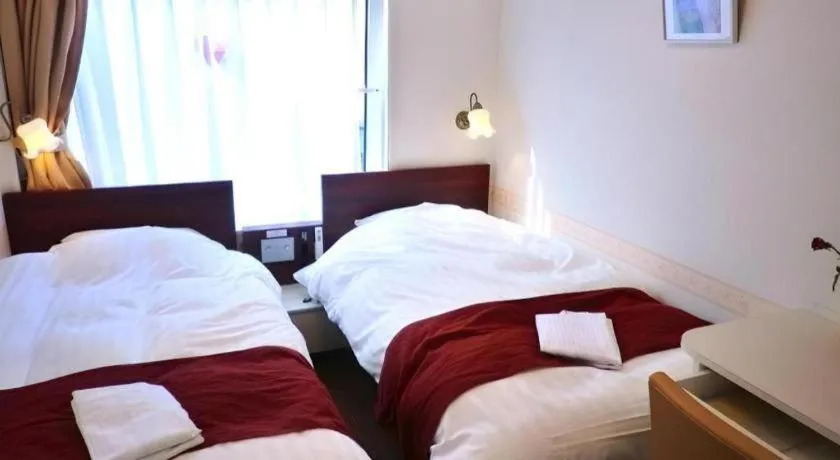 Bed in Hotel Shimbashi Sambankan