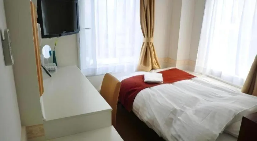 Bed in Hotel Shimbashi Sambankan