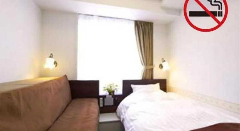 Bed in Hotel Shimbashi Sambankan