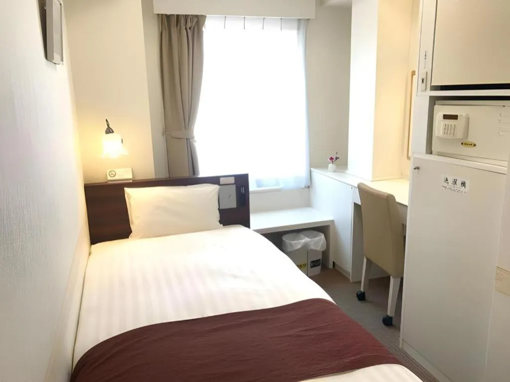 Bed in Hotel Shimbashi Sambankan