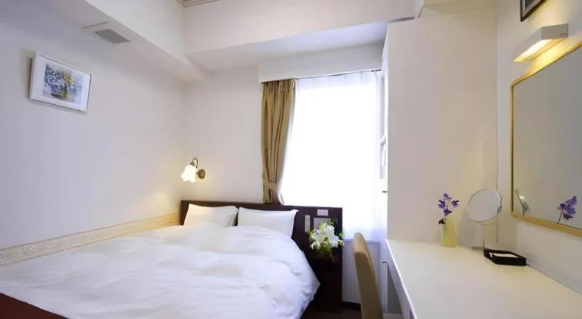 Bed in Hotel Shimbashi Sambankan