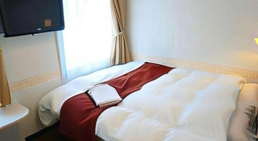 Bed in Hotel Shimbashi Sambankan