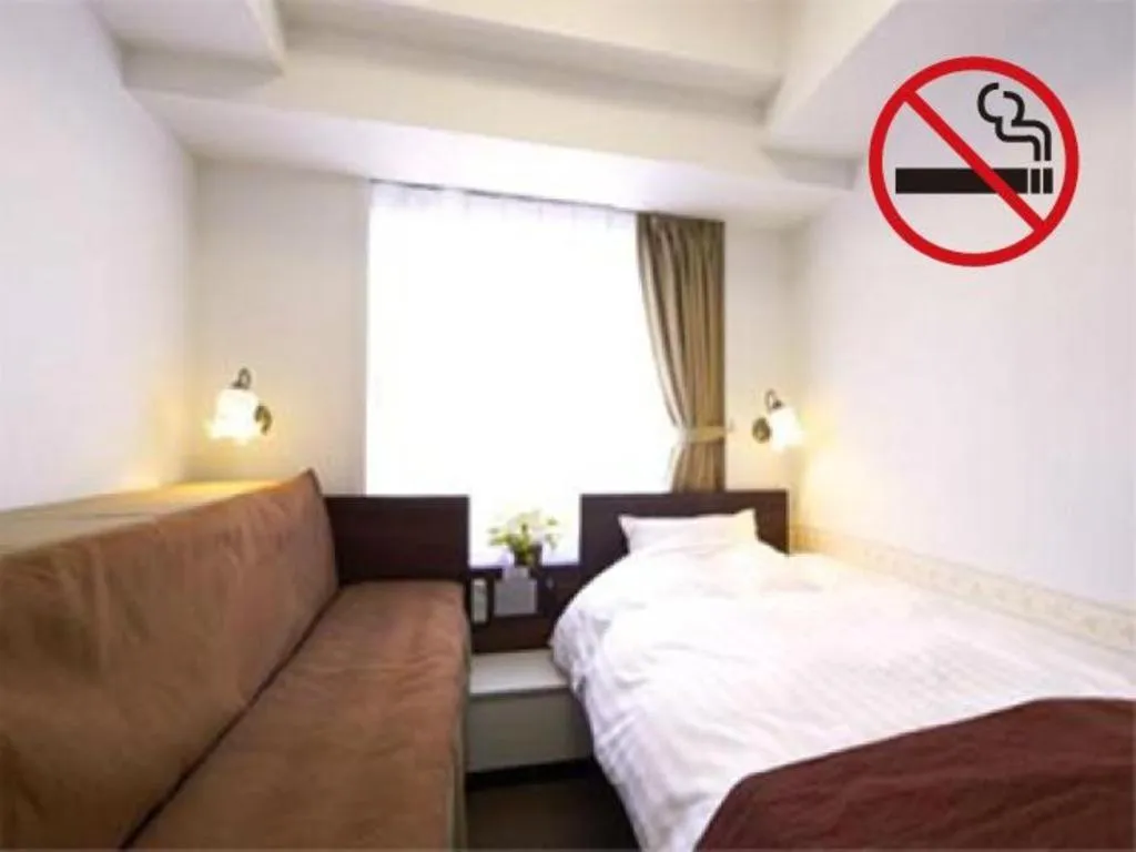 Bed in Hotel Shimbashi Sambankan