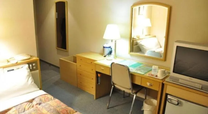 Bed in Palace Inn Toyota