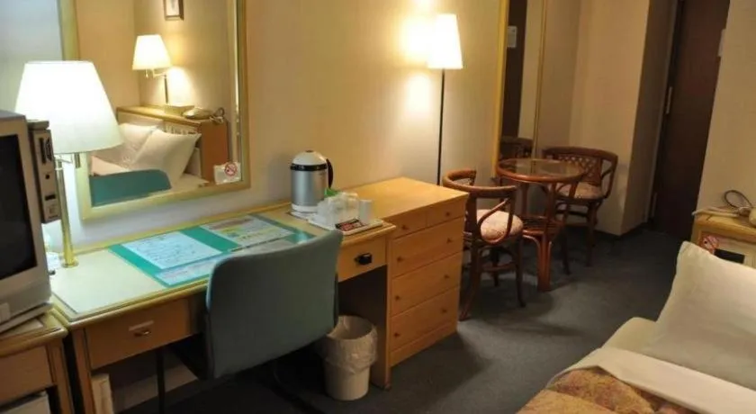 Bed in Palace Inn Toyota