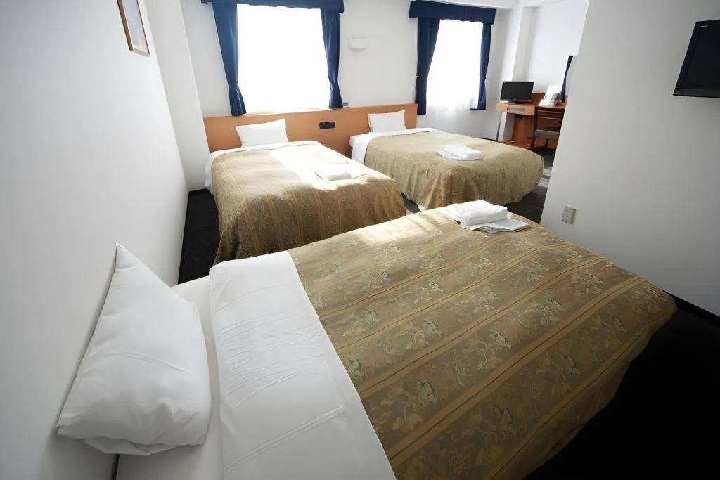 Bed in Hirata Maple Hotel