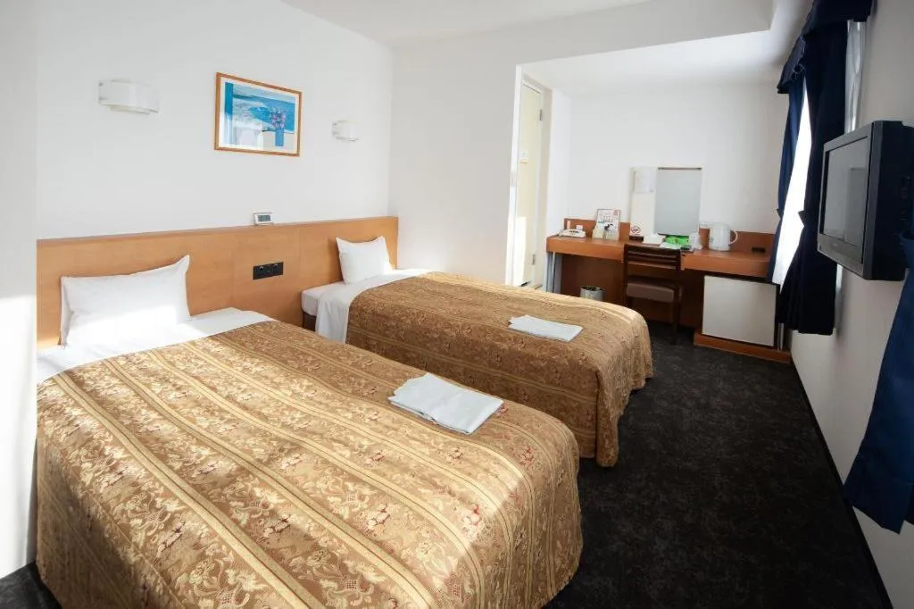 Bed in Hirata Maple Hotel