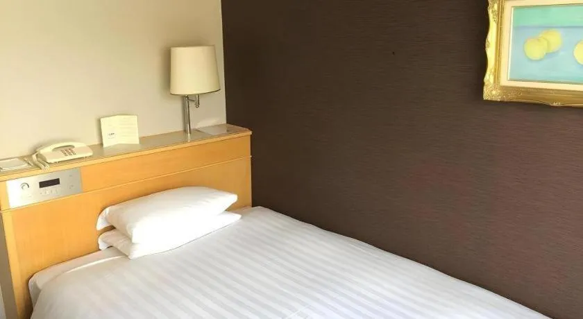 Bed in Green Hill Hotel Onomichi