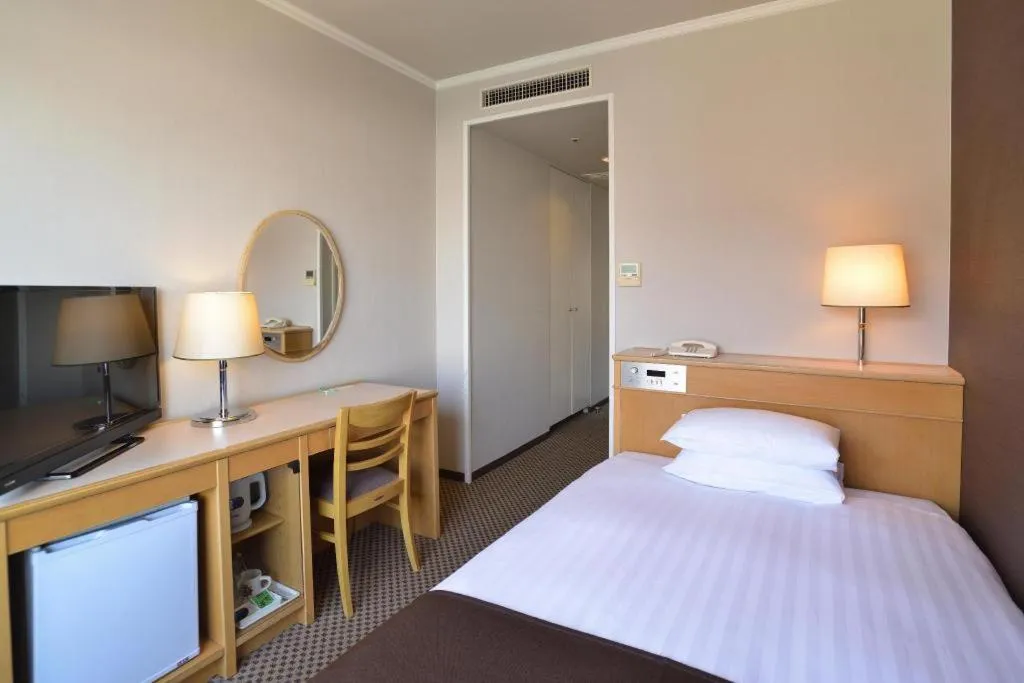 Bed in Green Hill Hotel Onomichi