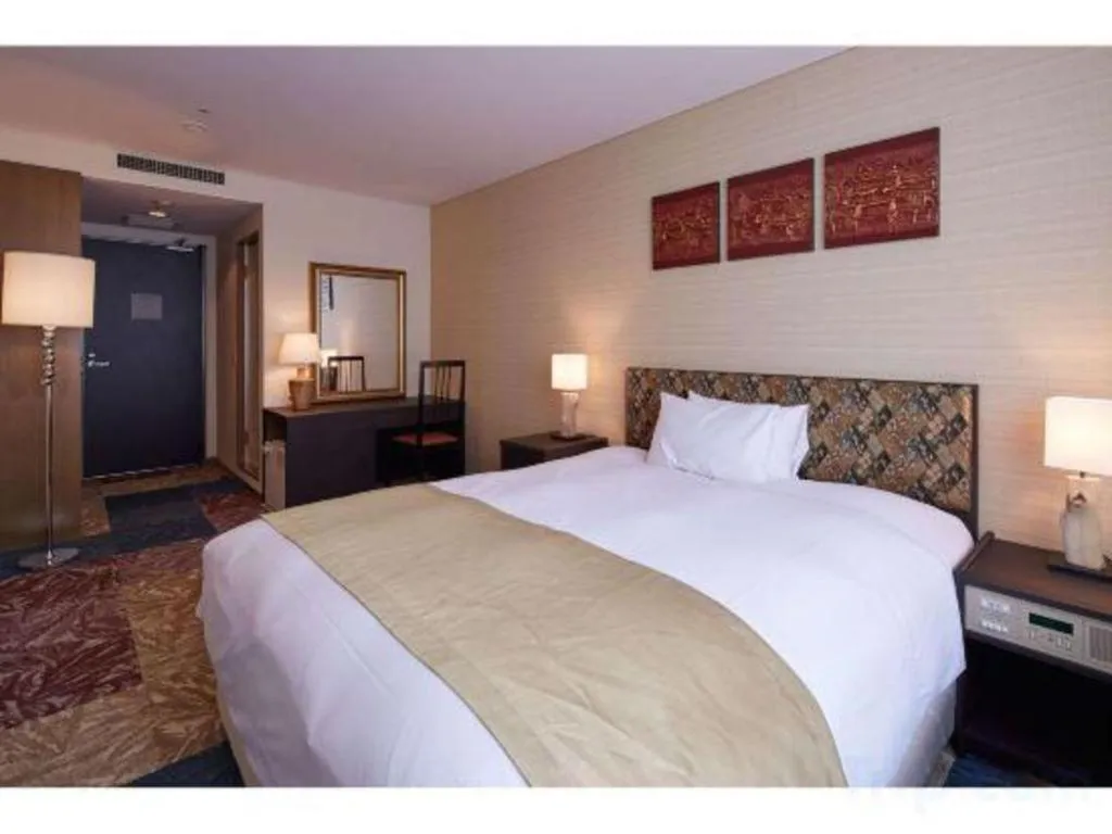 Bed in Centurion Hotel Technoport Fukui- Artificial Radium Hot Spring