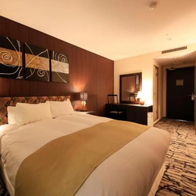 Bed in Centurion Hotel Technoport Fukui- Artificial Radium Hot Spring