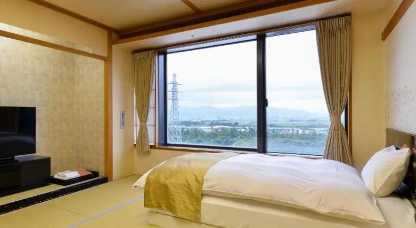 Bed in Centurion Hotel Technoport Fukui- Artificial Radium Hot Spring