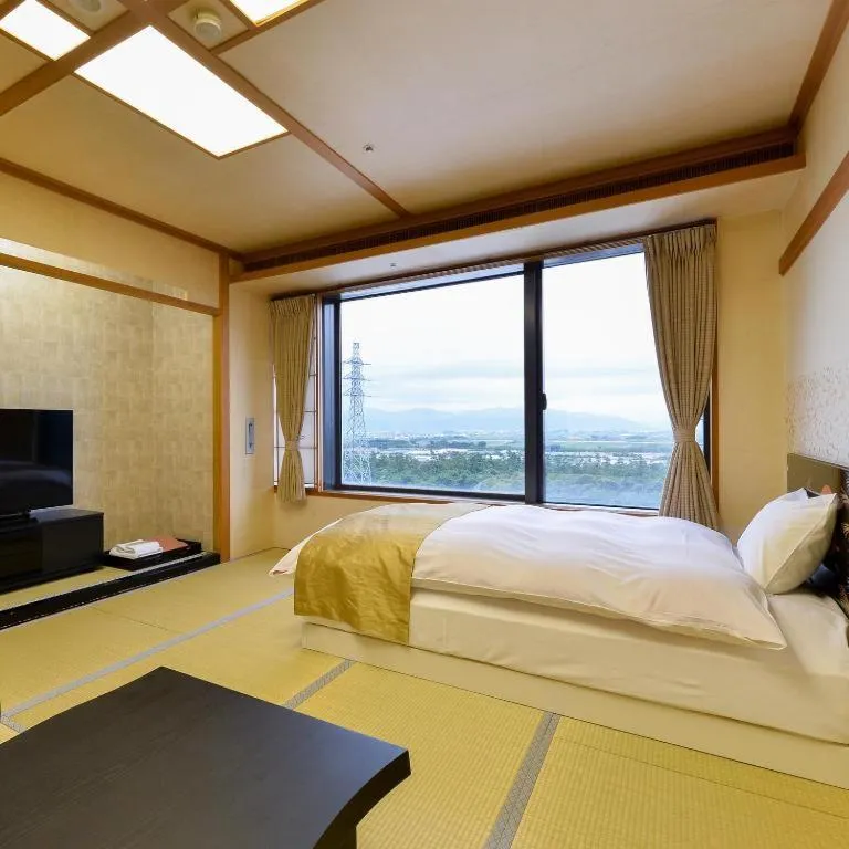 Bed in Centurion Hotel Technoport Fukui- Artificial Radium Hot Spring