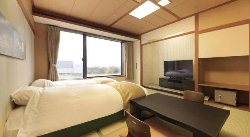 Bed in Centurion Hotel Technoport Fukui- Artificial Radium Hot Spring