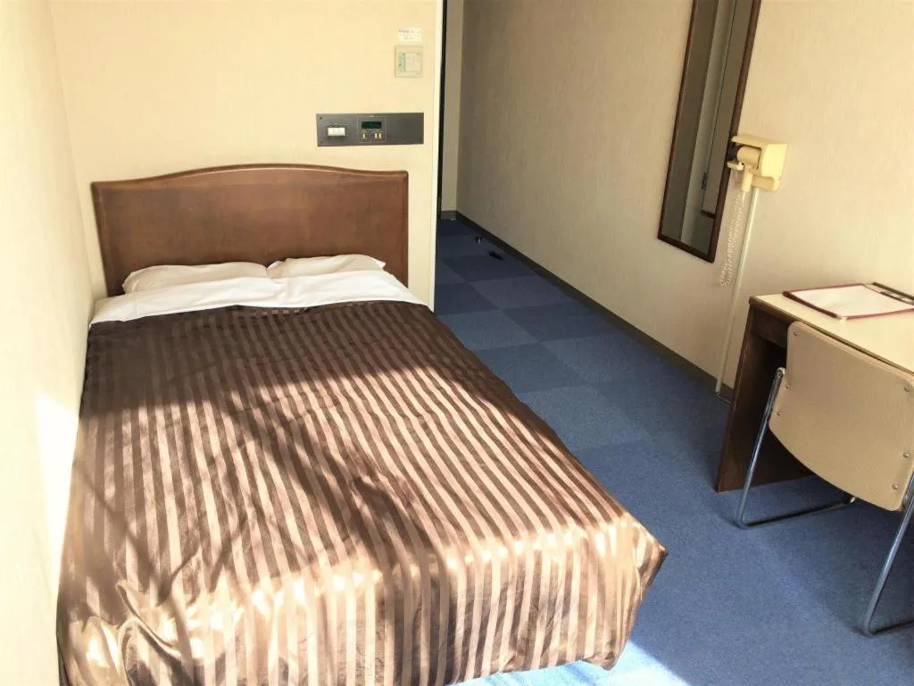 Bed in Ichimanri Hotel Golden Century