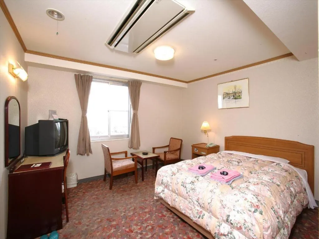 Bed in Ichimanri Hotel Golden Century