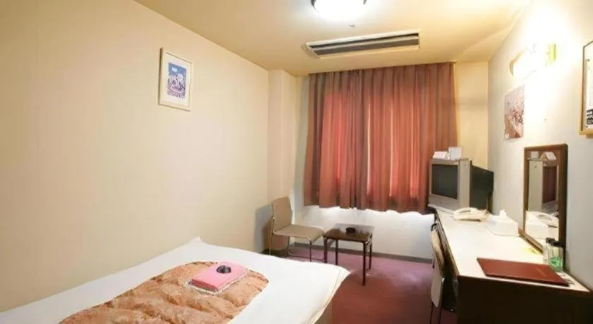 Bed in Ichimanri Hotel Golden Century