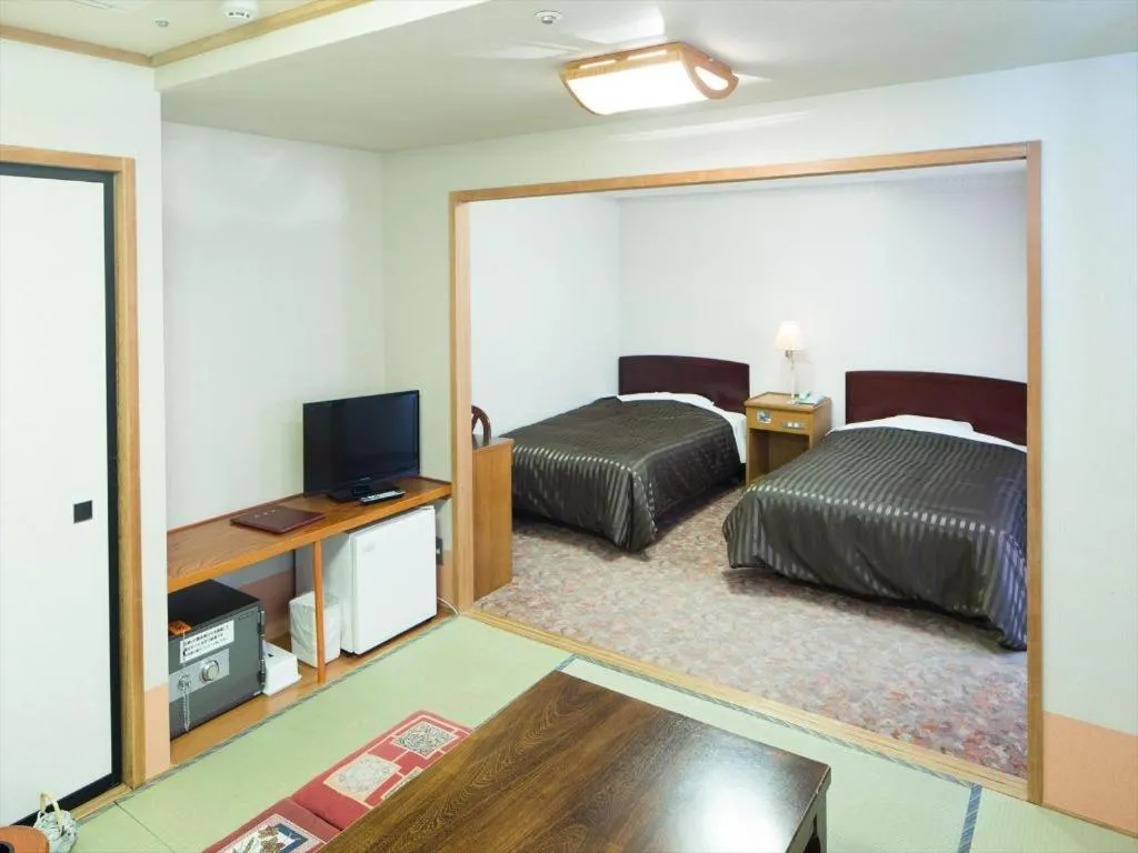 Bed in Ichimanri Hotel Golden Century