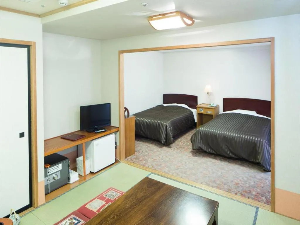 Bed in Ichimanri Hotel Golden Century