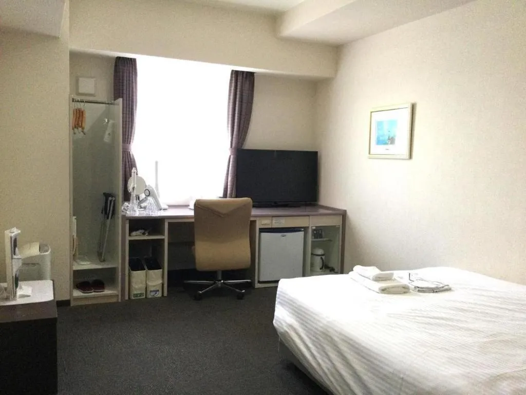 Bed in Shiroko Storia Hotel