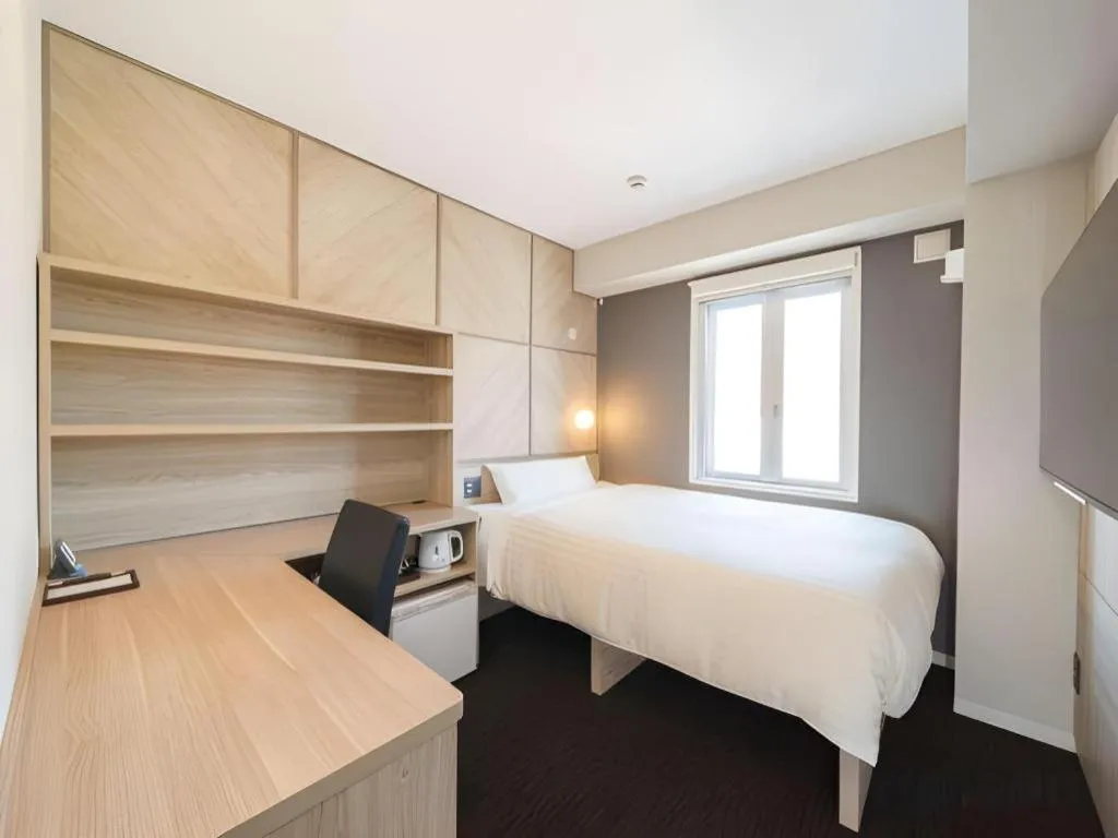 Bed in Super Hotel Satsuma Sendai