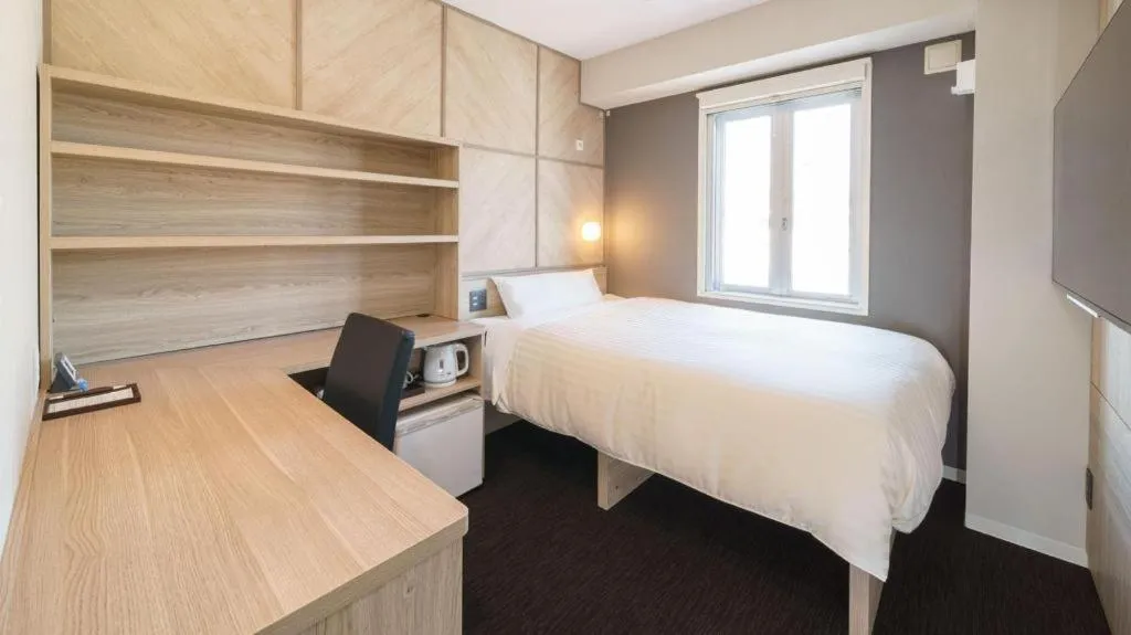 Bed in Super Hotel Satsuma Sendai