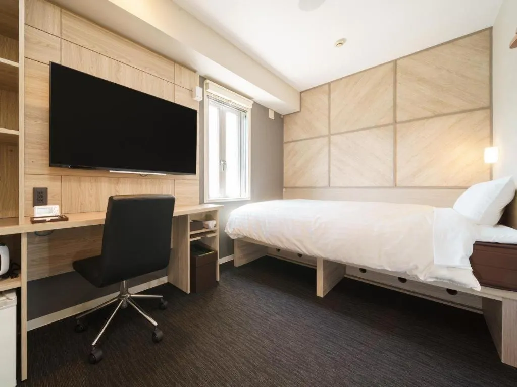 Bed in Super Hotel Satsuma Sendai