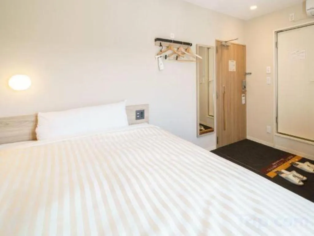 Bed in Super Hotel Satsuma Sendai