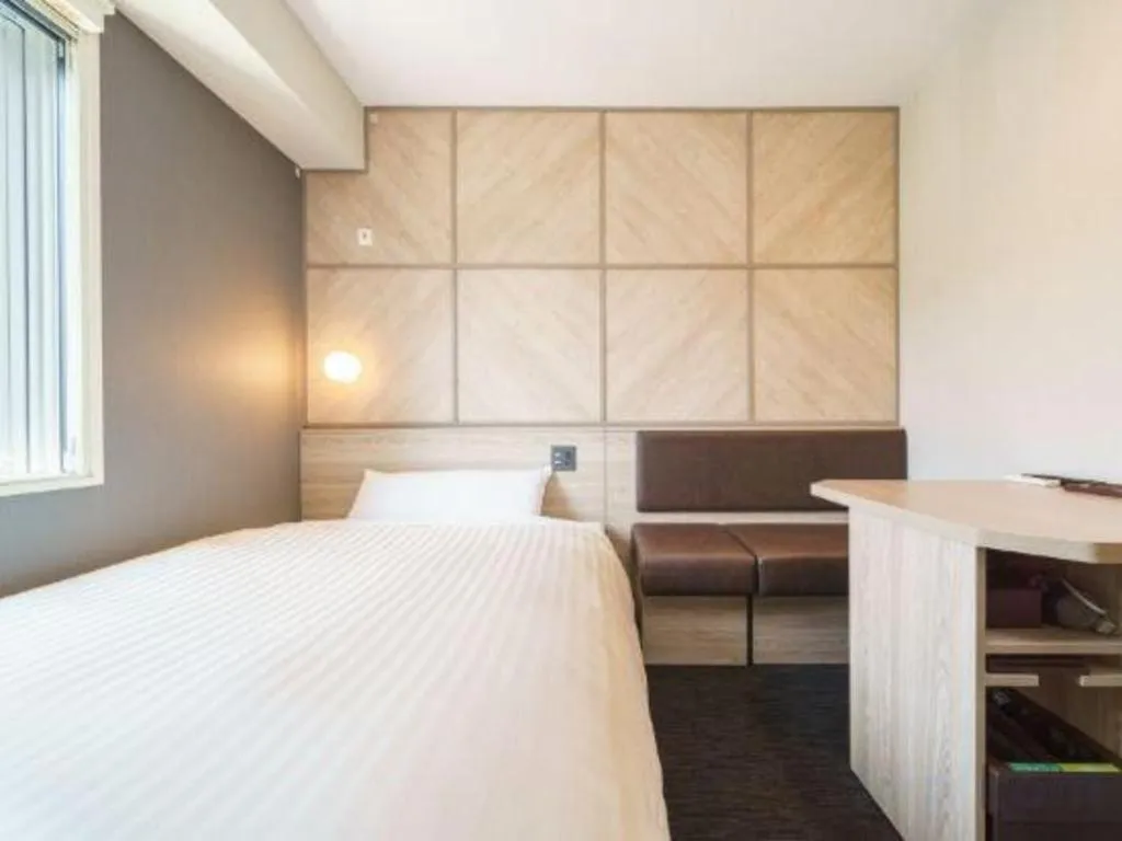 Bed in Super Hotel Satsuma Sendai