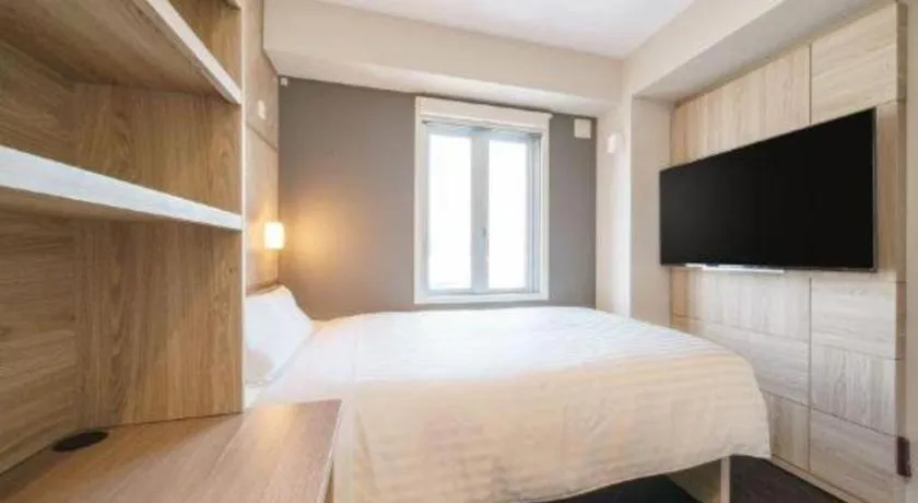 Bed in Super Hotel Satsuma Sendai