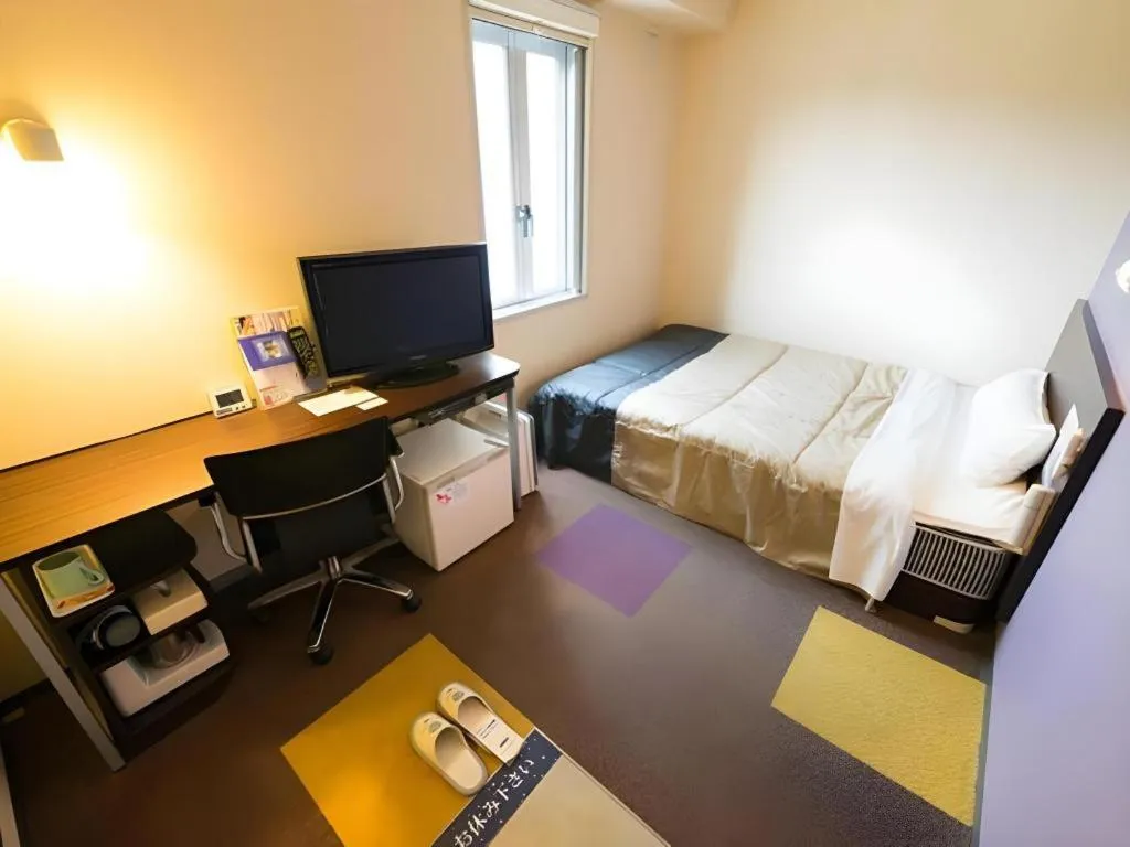 Bed in Super Hotel Satsuma Sendai