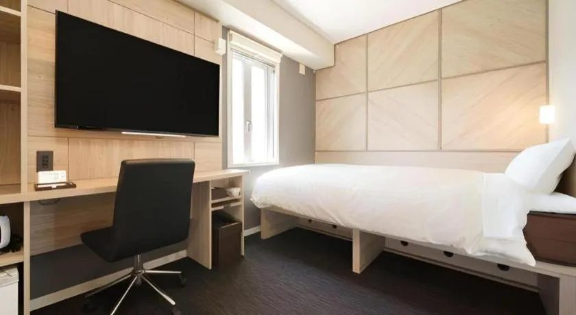 Bed in Super Hotel Satsuma Sendai