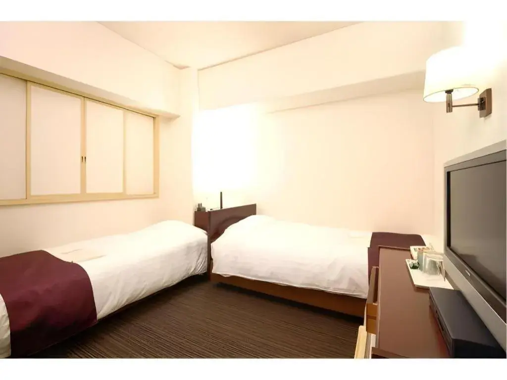 Bed in Ueda Plaza Hotel Bed in Ueda Plaza Hotel