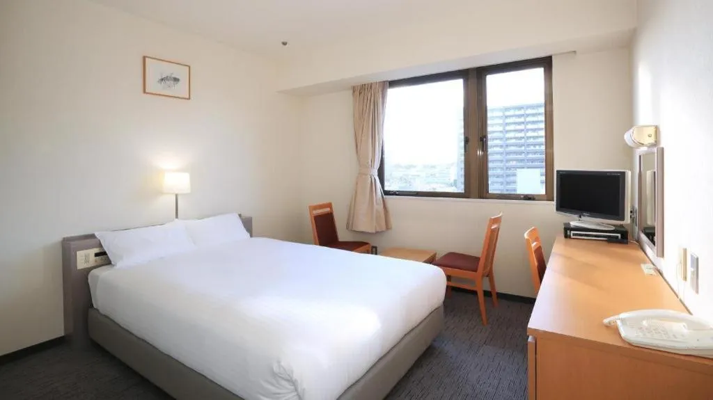 Bed in Smile Hotel Hirosaki