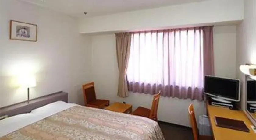 Bed in Smile Hotel Hirosaki Bed in Smile Hotel Hirosaki