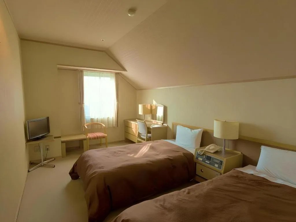 Bed in Washigatake Kogen Hotel Rainbow