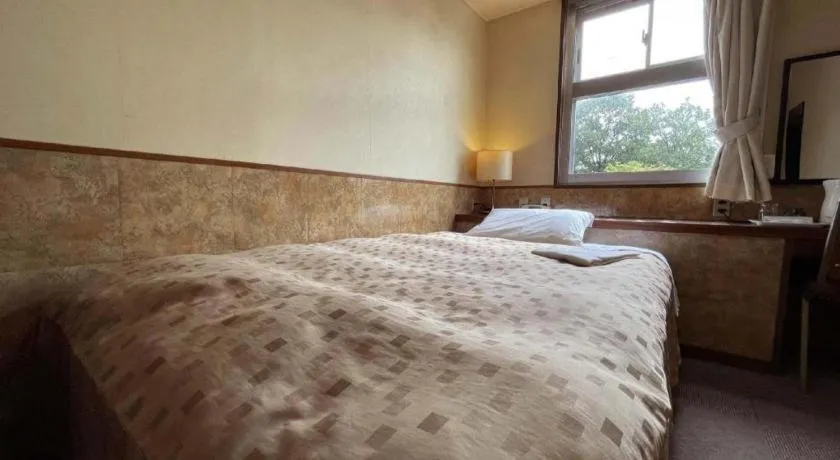 Bed in Fuji Park Hotel