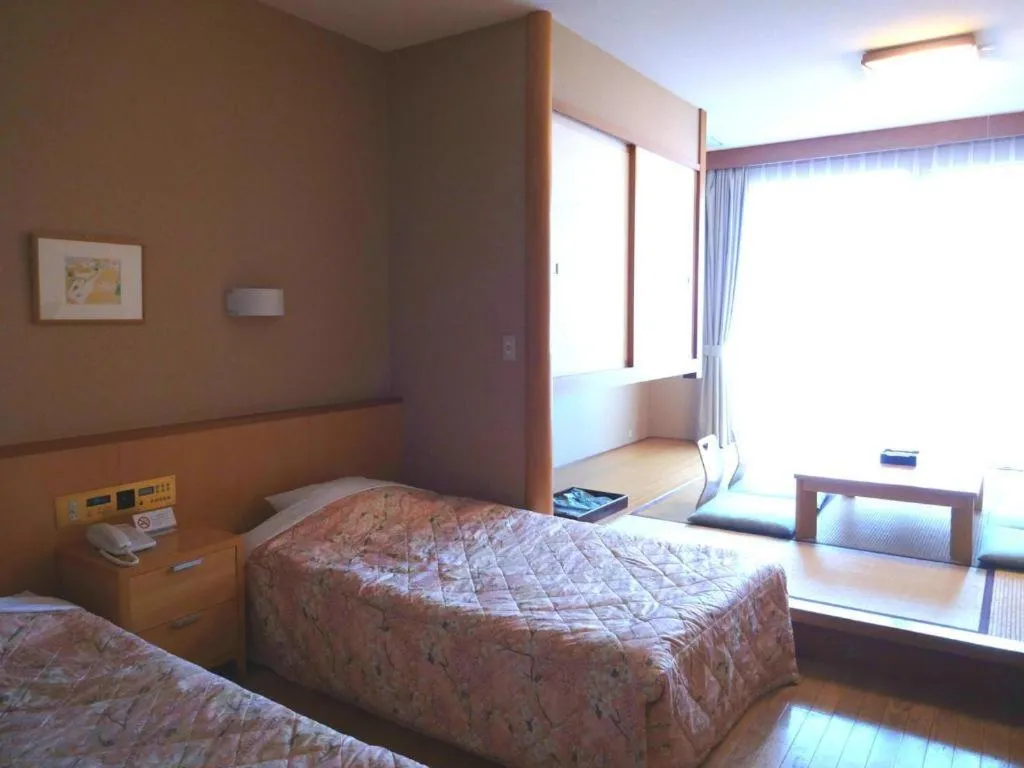 Bed in Sea Side Villa Bokkai